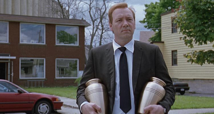 The Shipping News 2001 Movie Scene Kevin Spacey as Quoyle holding two urns in front of his home in New York