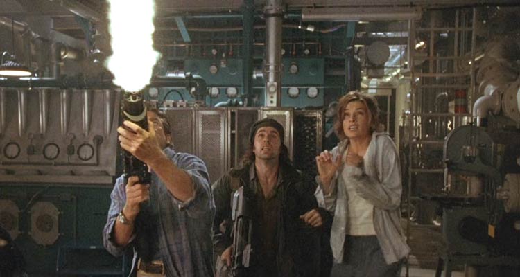Deep Rising 1998 Movie Scene Treat Williams as Finnegan firing his gun at the monster, Kevin J. O'Connor as Pantucci and Famke Janssen as Trillian afraid