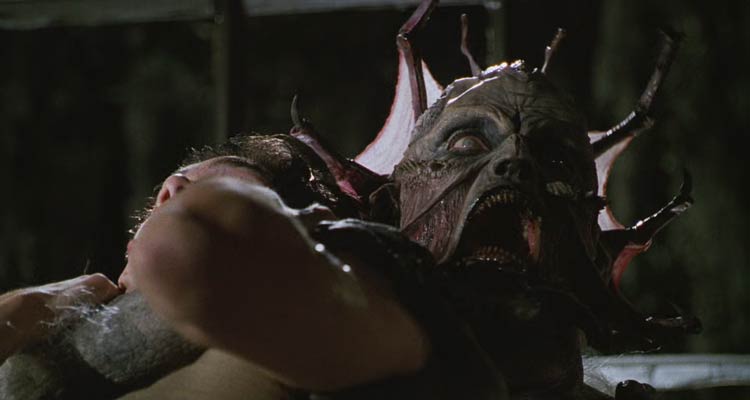 Jeepers Creepers 2001 Movie Scene The monster holding his victim screaming and showing webbed claws on his head