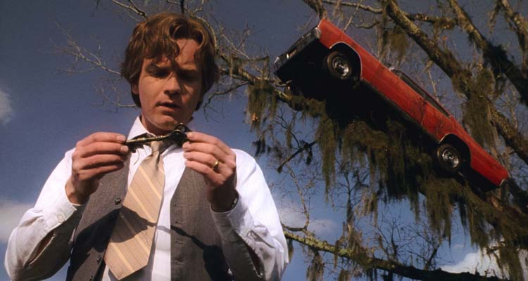 Big Fish 2003 Movie Scene Ewan McGregor as Ed Bloom holding the key with his car in a tree above him