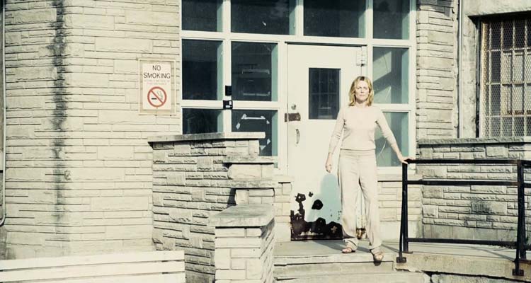 Blindness 2008 Movie Scene Julianne Moore as Doctor's Wife stepping out in the sun in the courtyard