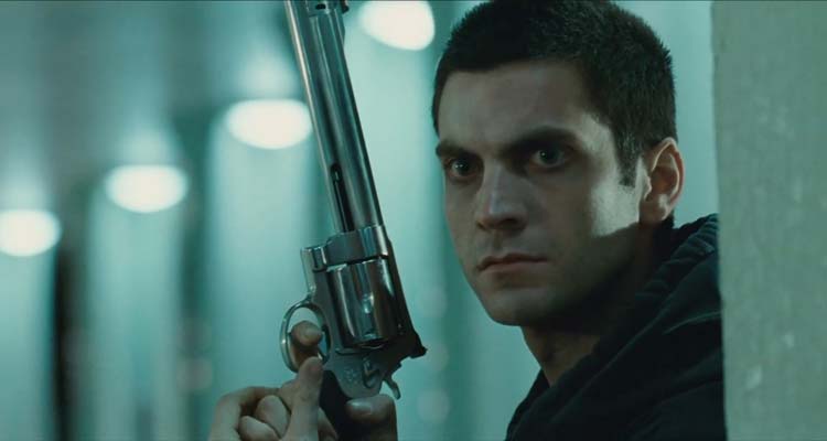 Dolans Cadillac 2009 Movie Scene Wes Bentley as Robinson holding a huge handgun