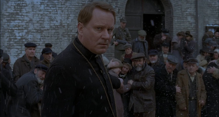 Dominion Prequel to the Exorcist 2005 Movie Scene Stellan Skarsgård as Father Lankester Merrin in a small village in occupied Holland during WWII