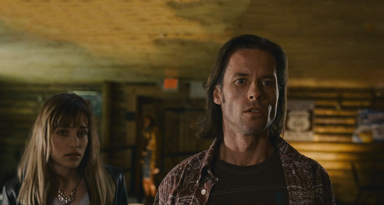 First Snow 2006 Movie Scene Guy Pearce as Jimmy Starks and Piper Perabo as Deirdre asking about fortune teller Vacaro at the local bar