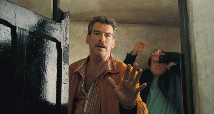 The Matador 2005 Movie Scene Pierce Brosnan as the hitman Julian Noble apologizing to the man he was about to kill at a bullfight with Greg Kinnear as Danny Wright panicking in the background