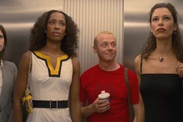 How to Lose Friends Alienate People 2008 Movie Scene Simon Pegg as Sidney Young in an elevator with three tall and beautiful models