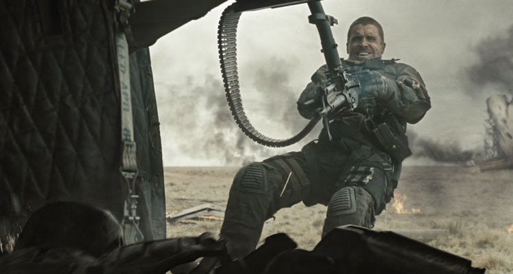 Terminator Salvation 2009 Movie Scene Christian Bale as John Connor using a minigun on a helicopter to shoot a killer robot