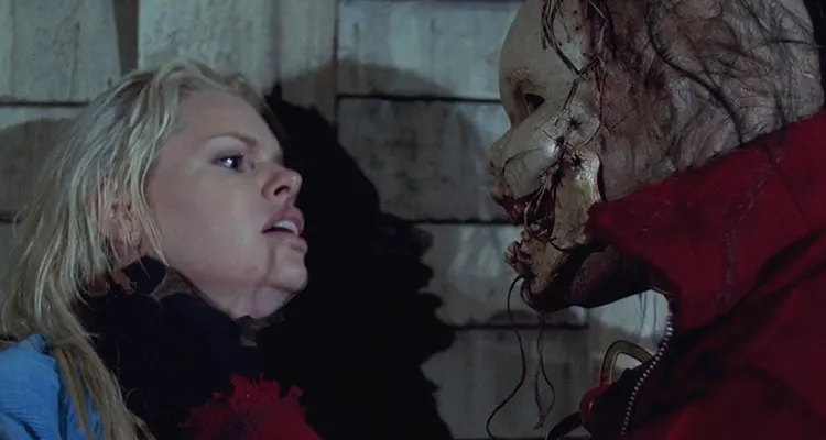 The Hills Run Red 2009 Movie Scene Sophie Monk as Alexa caught by the killer known as babyface