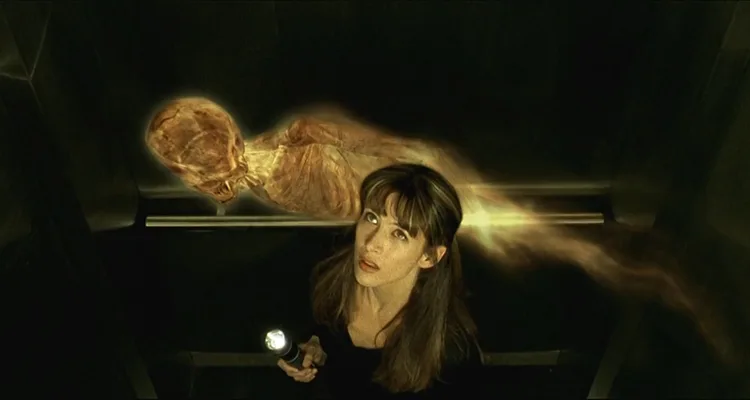 Belphegor Phantom of The Louvre 2001 Movie Scene Sophie Marceau as Lisa in an elevator with the mummy ghost Belphegor flying around her