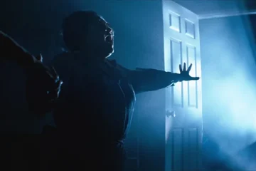 Poltergeist 1982 Movie Scene Zelda Rubinstein as Tangina trying to communicate with the spirits inside the house