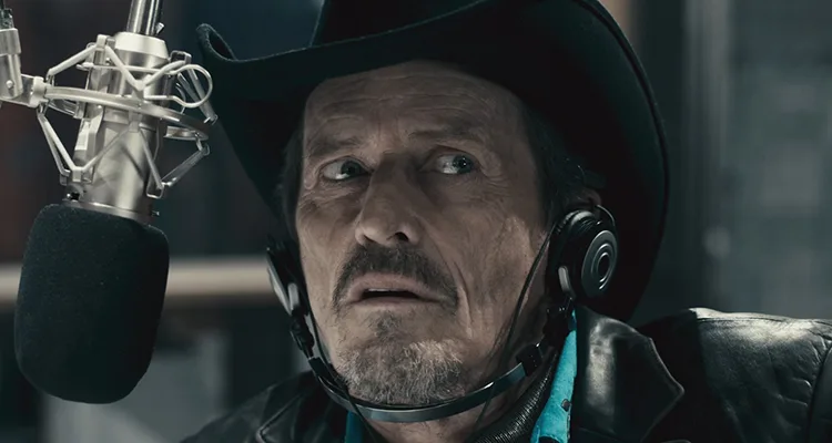 Pontypool 2008 Movie Scene Stephen McHattie as Grant Mazzy talking into the microphone at the radio station