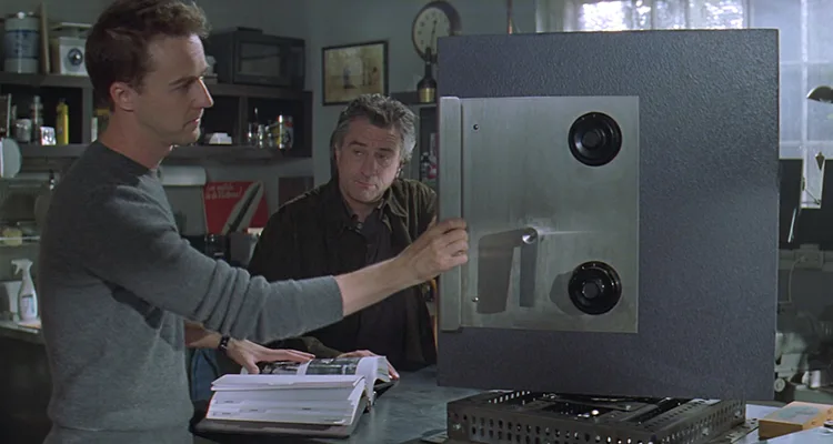 The Score 2001 Movie Scene Edward Norton as Jack and Robert De Niro as Nick practicing safe cracking