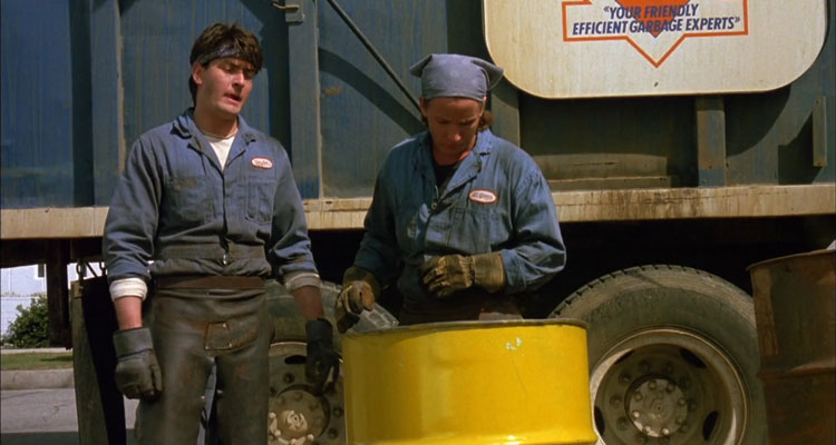 Men At Work 1990 Movie Scene Charlie Sheen as Carl Taylor and Emilio Estevez as James St. James finding something while they're loading up garbage