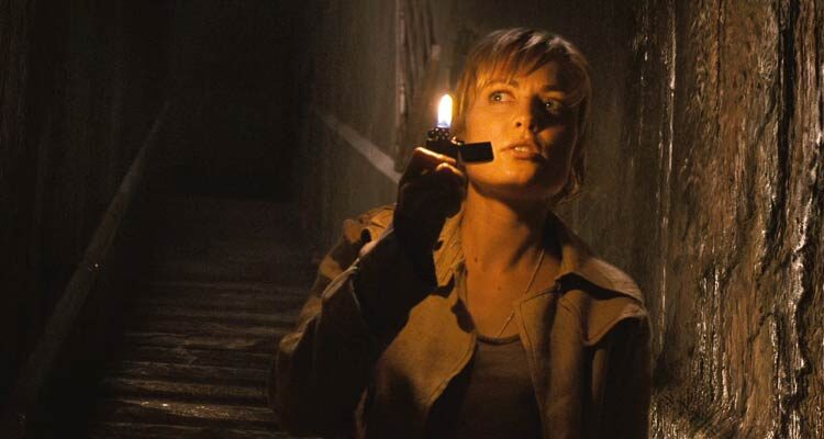 Silent Hill 2006 Movie Scene Radha Mitchell as Rose Da Silva using a lighter to see into the dark basement beneath the city