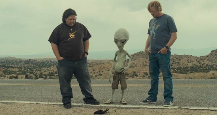Paul 2011 Movie Scene Simon Pegg as Graeme, Nick Frost as Clive and Seth Rogen as Paul, the alien standing next to a road and looking at a dead bird