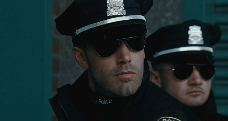 The Town 2010 Movie Scene Ben Affleck as Doug and Jeremy Renner as James wearing police uniforms about to pull a heist