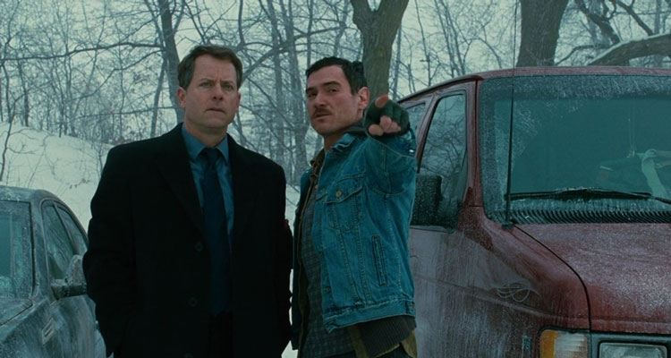 Thin Ice 2011 Movie Scene Billy Crudup as Randy showing Greg Kinnear as Mickey Prohaska where they buried the body in the snow