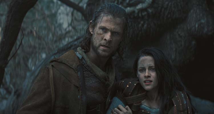 Snow White and the Huntsman 2012 Movie Scene Chris Hemsworth as The Huntsman and Kristen Stewart as Snow White in the dark forest