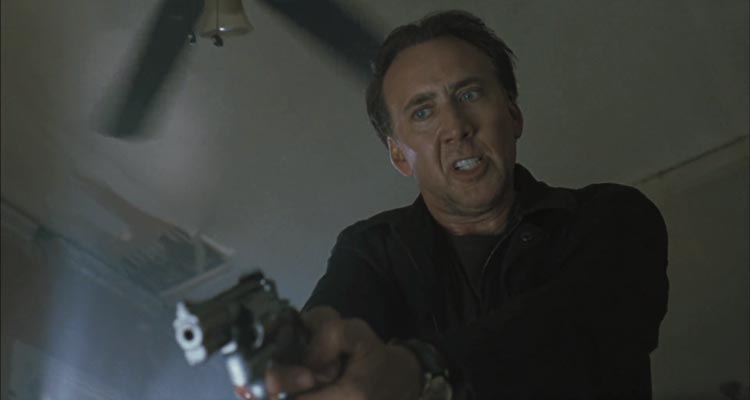Stolen 2012 Movie Scene Nicolas Cage as Will holding a gun and looking for his daughter