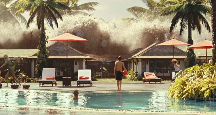The Impossible 2012 Movie Scene A small boy holding a red ball next to a pool looking at an incoming tsunami wave hitting the resort