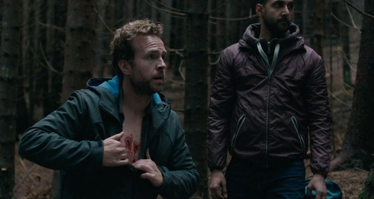 The Ritual 2017 Movie Rafe Spall showing wounds on his chest in the forest