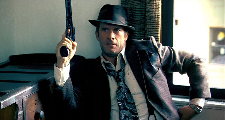 Give Em Hell Malone Sequel Coming - Scene from the original with Thomas Jane as Malone holding a gun