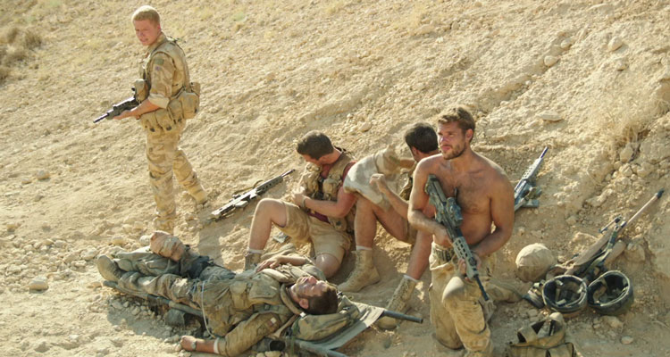Kajaki Movie 2014 Scene Paratroopers guarding a wounded soldier in Afghanistan