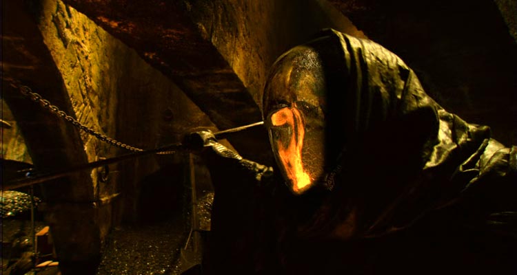 Vidocq 2001 Movie Scene The Alchemist wearing a golden reflective mask and a black cape