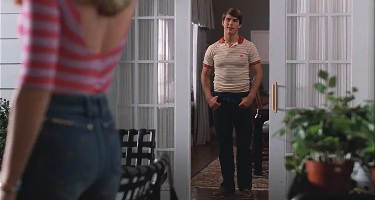 Risky Business 1983 Movie Scene Tom Cruise as Joel looking at Rebecca De Mornay as Lana in tight jeans