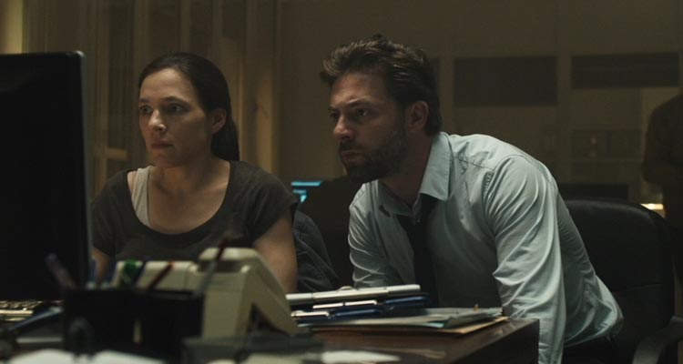 The Treatment AKA De Behandeling 2014 Movie Geert Van Rampelberg as Nick Cafmeyer looking at the computer screen trying to find a serial kidnapper