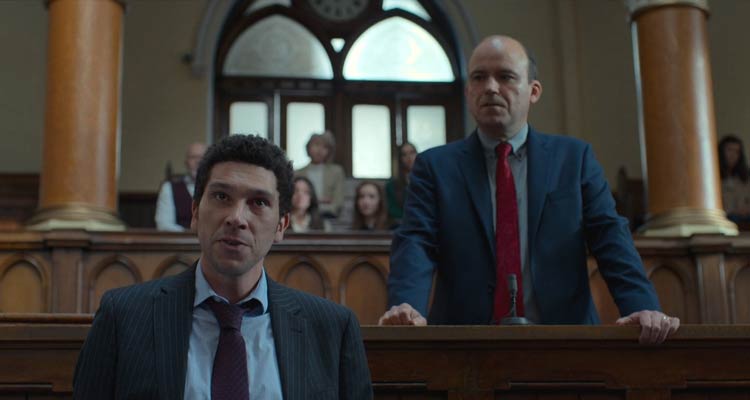Bank Of Dave 2023 Movie Scene Joel Fry as Hugh and Rory Kinnear as Dave arguing in court