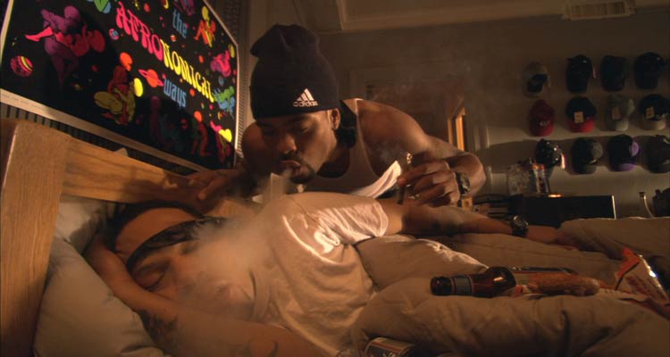 How High 2001 Movie Scene Method Man as Silas blowing marijuana smoke into Redman as Jamal trying to wake him up