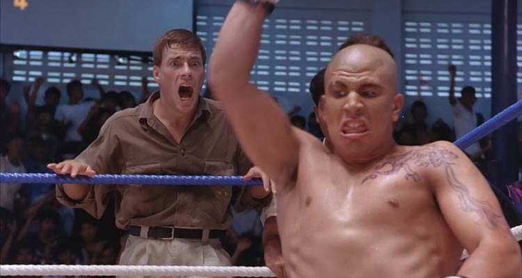 Kickboxer 1989 Movie Scene Michel Qissi as Tong Po breaking the back of Dennis Alexio as Eric with Jean-Claude Van Damme as Kurt screaming in the background