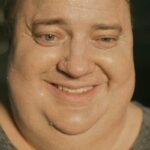 The Whale 2022 Movie Scene Brendan Fraser as Charlie, morbidly obese gay online teacher, laughing in the sunlight