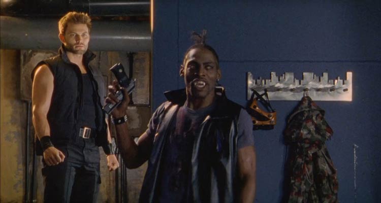 Dracula 3000 2004 Movie Scene Coolio as 187 the vampire holding a gun he took from Casper Van Dien as Capt. Abraham Van Helsing