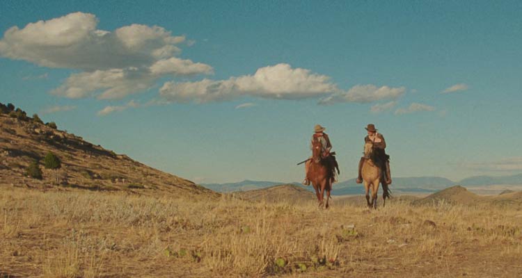 The Ballad of Lefty Brown 2017 Movie Scene Bill Pullman as Lefty Brown and Peter Fonda as Edward Johnson riding into the Montana sunset looking for rustlers who stole their horses