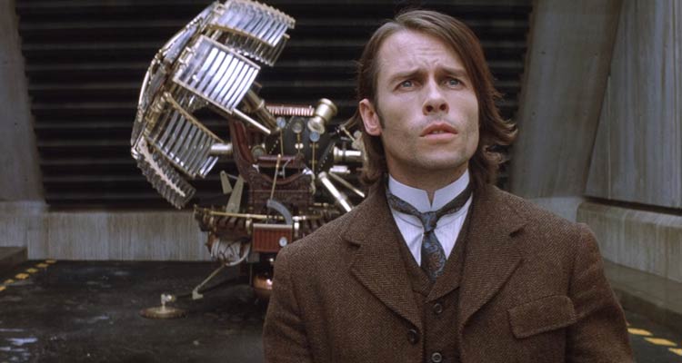 The Time Machine 2002 Movie Scene Guy Pearce as Alexander Hartdegen with the steampunk-looking time machine in the background seeing the future for the first time