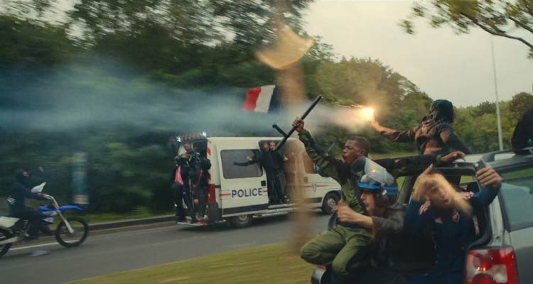 Athena 2022 Movie Scene Rioters driving in a stolen police van heading to their hood