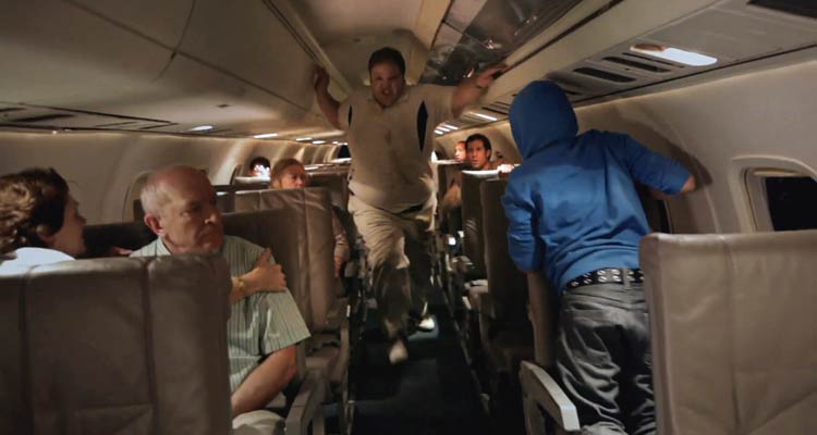 Quarantine 2 Terminal 2011 Movie Scene One of the passengers is now infected as a zombie and is trying to kill others on an airplane