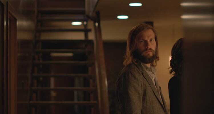 The Invitation 2015 Movie Scene Logan Marshall-Green as Will noticing that something is wrong with this diner party