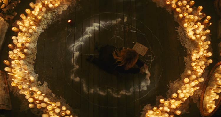 The Skeleton Key 2005 Movie Scene Kate Hudson as Caroline Ellis performing a hoodoo ritual surrounded by candles and salt
