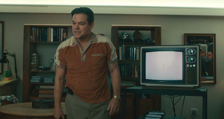 Air 2023 Movie Scene Matt Damon as Sonny Vaccaro, Nike executive next to an old eighties television set
