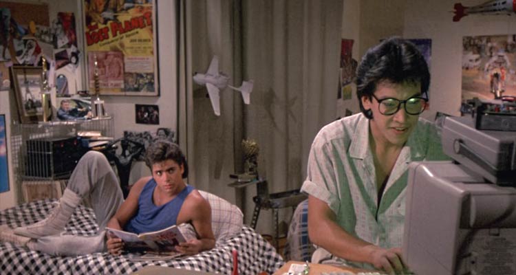 Never Too Young To Die 1985 Movie Scene John Stamos as Lance Stargrove and Peter Kwong as Cliff in their dorm room