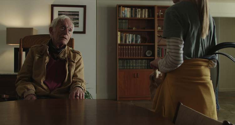 The Artifice Girl 2023 Movie Scene Lance Henriksen as Gareth talking to Tatum Matthews as Cherry