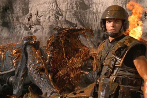 Starship Troopers 1997 Movie Scene Casper Van Dien as Johnny Rico in front of a bug he just blew up