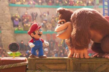 The Super Mario Bros Movie 2023 Scene Mario standing on a crate next to Donkey Kong