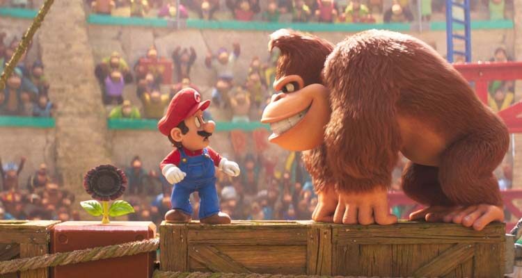 The Super Mario Bros Movie 2023 Scene Mario standing on a crate next to Donkey Kong