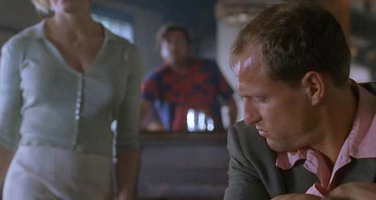 Palmetto 1998 Movie Scene Woody Harrelson as Harry Barber in the bar watching femme fatale walk by him