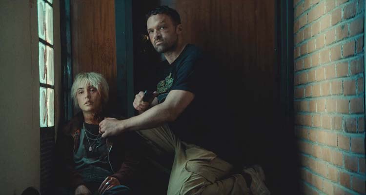 AKA 2023 Movie Scene Alban Lenoir as Adam Franco and Nathalie Odzierejko or Natoo as Mona in front of a door