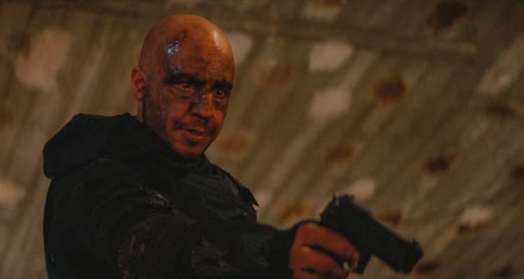 Darkland 2017 Movie Scene Dar Salim as Zaid holding a gun and avenging his brother's death